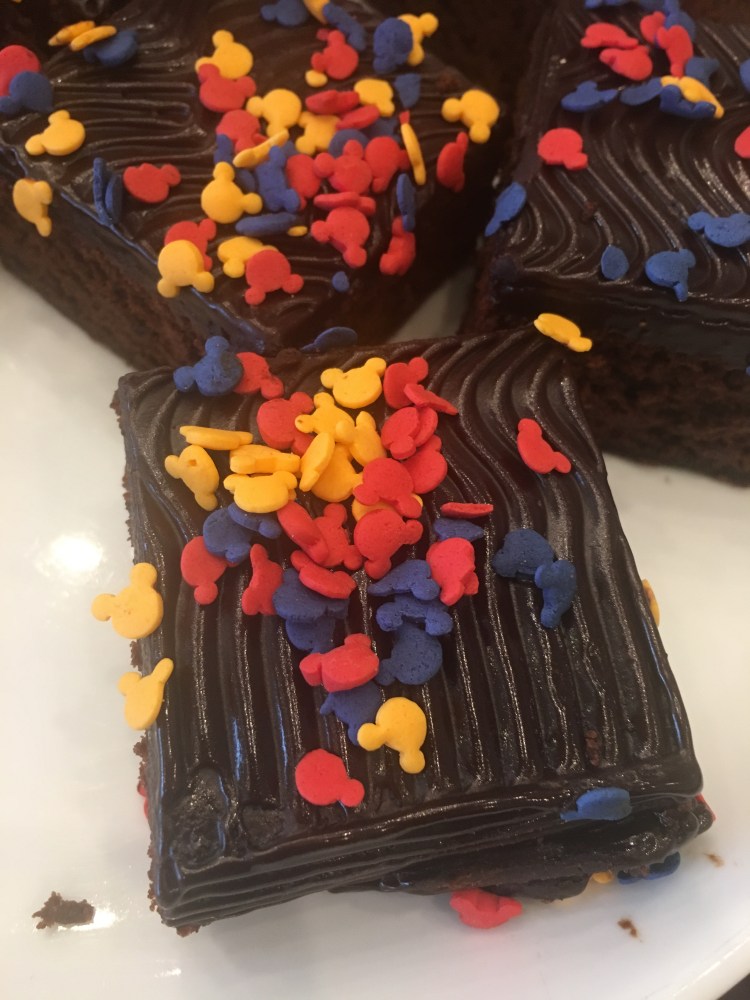 Brownies covered with colorful Micky Mouse shaped sprinkles