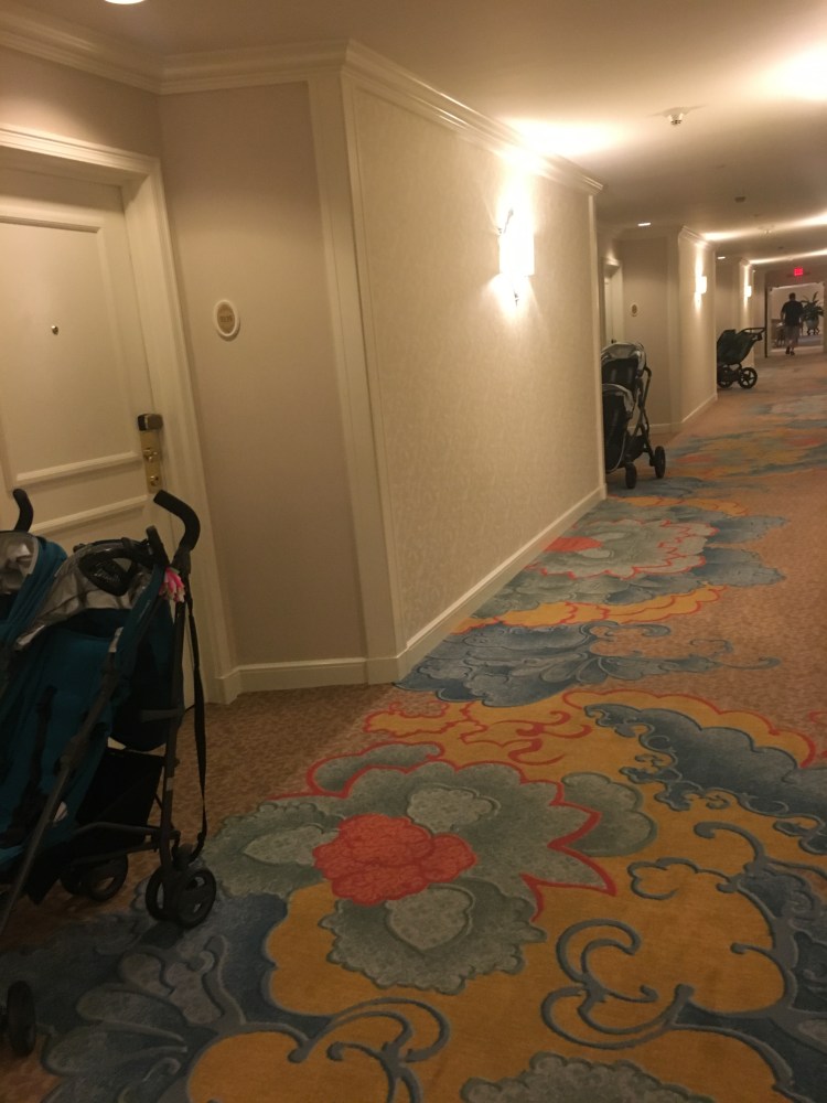 Strollers parked in hallway of hotel